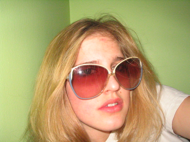 a woman with a pair of sunglasses on