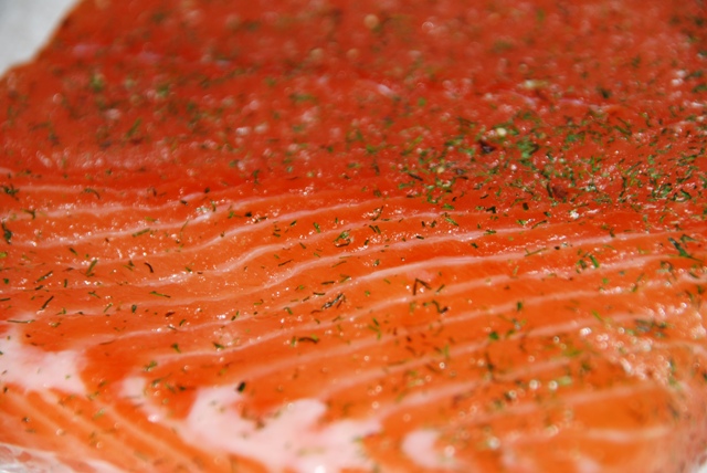 a close up of salmon that is cooking on some tin foil