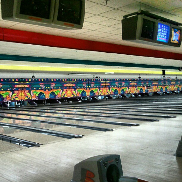a bowling alley with many colorful lanes painted on them