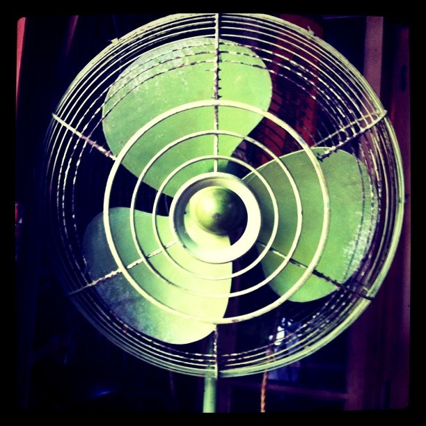 the propeller on a fan has a green color