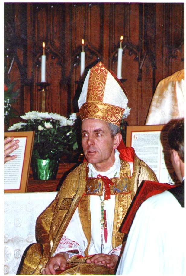 an old priest is wearing a gold crown