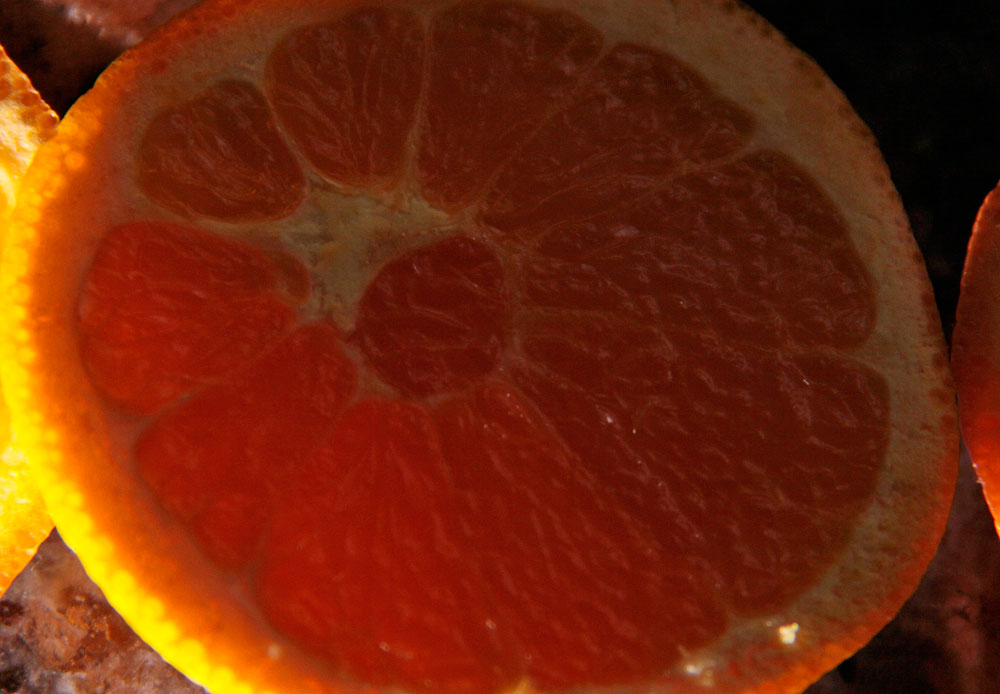 a gfruit cut in half and placed on a counter top