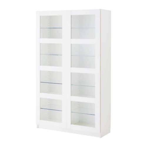 an empty white cabinet with glass doors