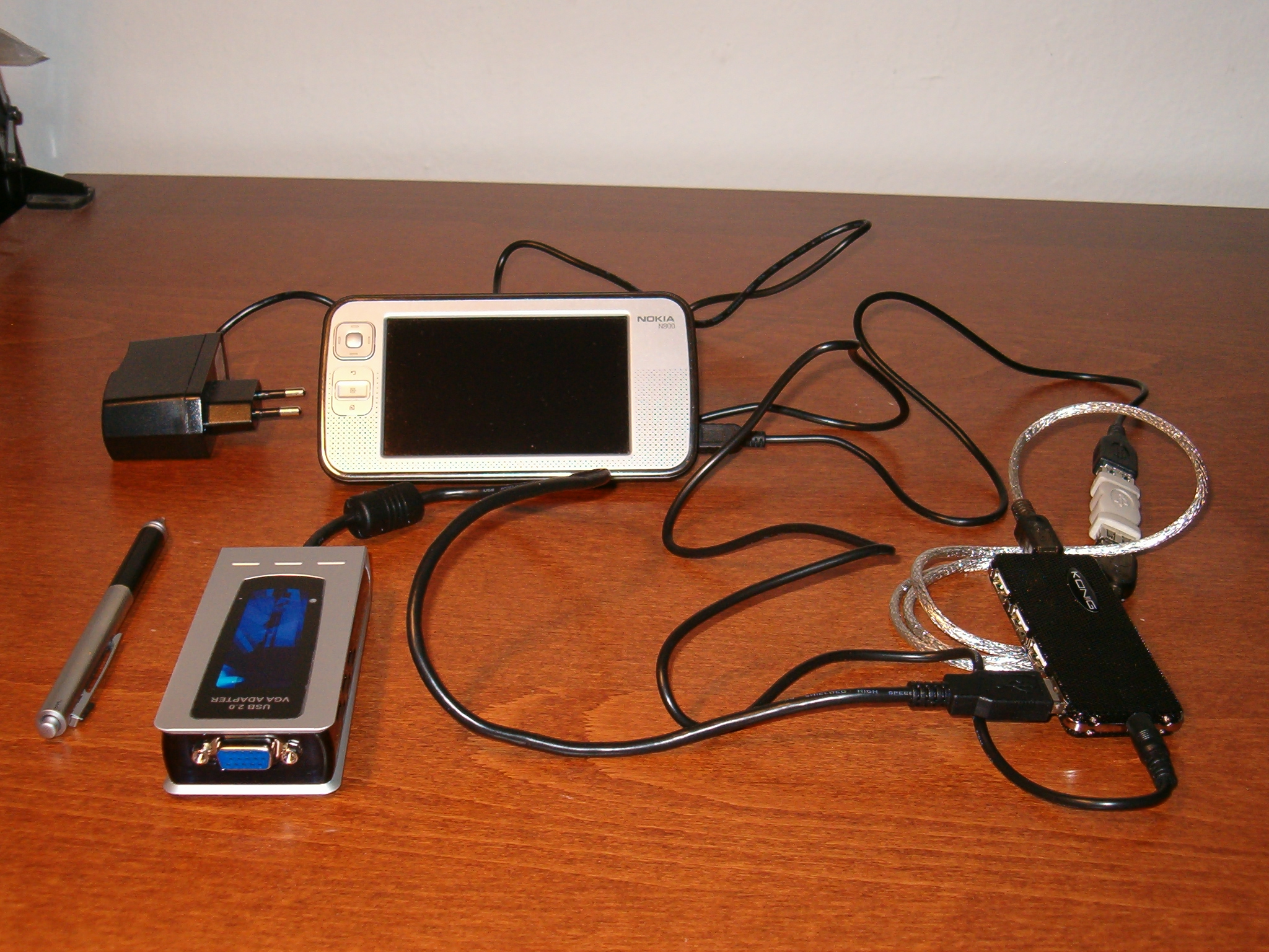 various electronic equipment are laying out on a table