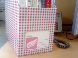 a red and white book that is on a desk