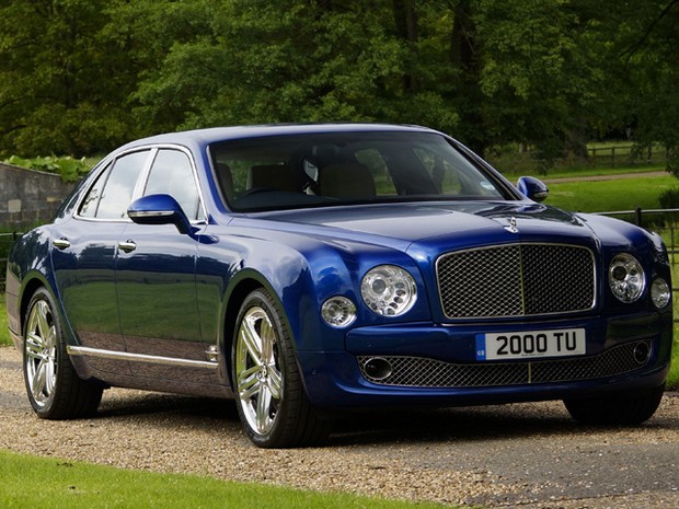 a blue bentley mulsworth limousine parked on a driveway
