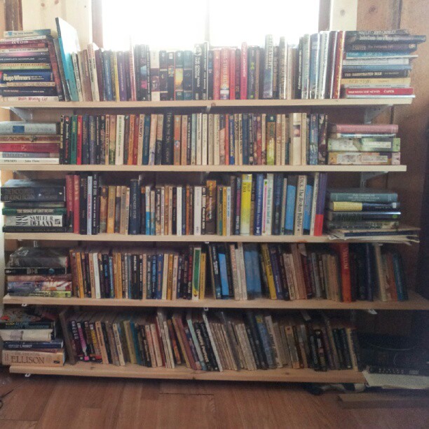 the bookcase in this room is filled with books