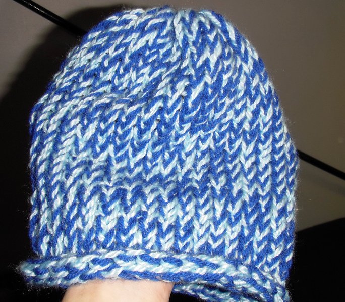 a blue hat with a large hole at the peak