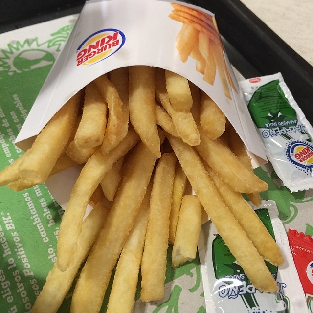 fries in a wrapper on a table
