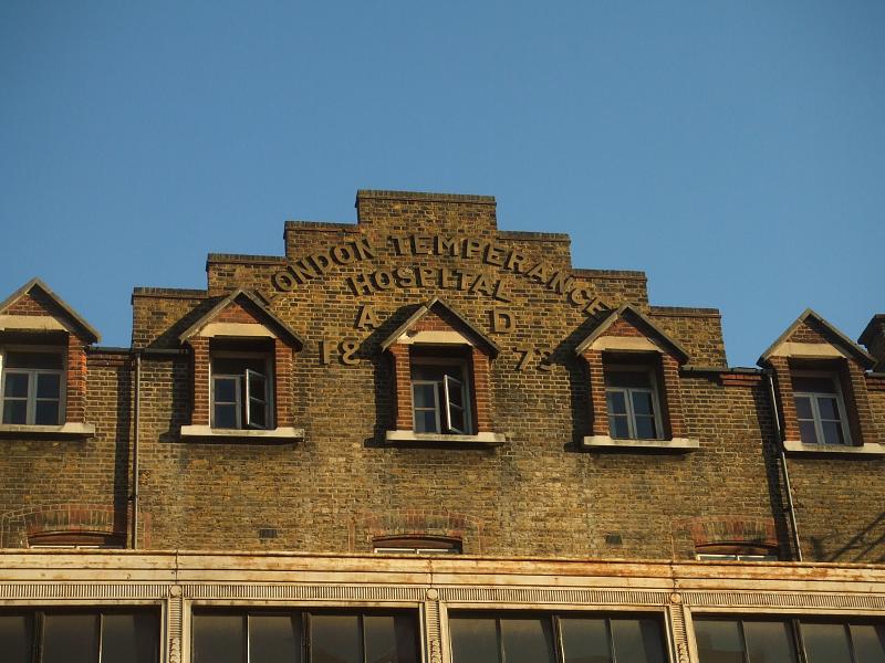 a very old building with the windows that have red brick trim