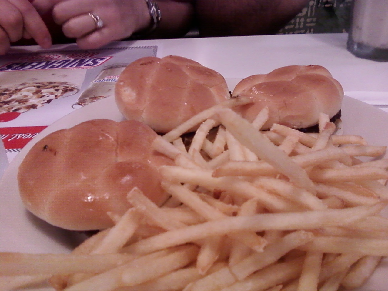 a plate topped with french fries covered in cheese