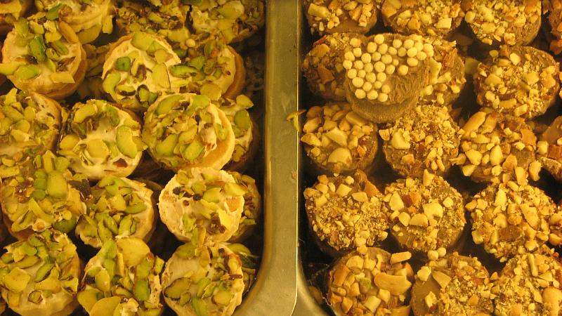 two trays filled with food next to each other