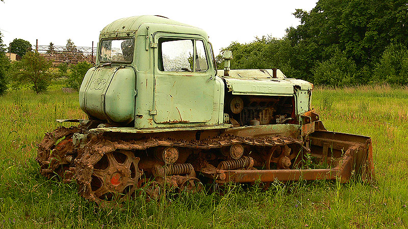 old and rusty truck parked in the grass