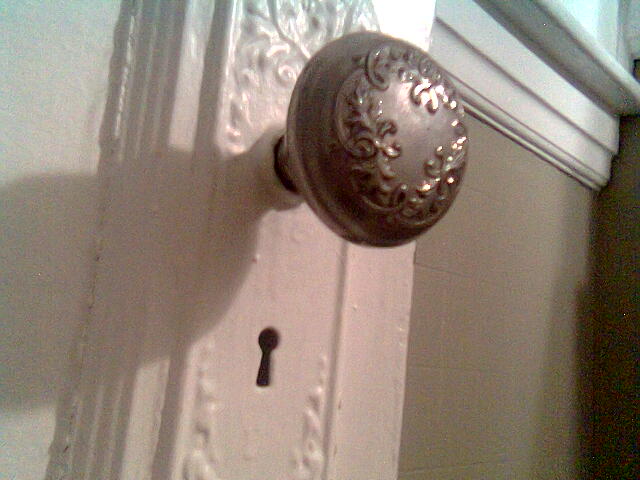 a door  and key that is on the front of a door