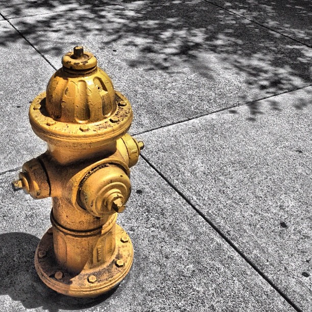 an old fire hydrant on the side of the road