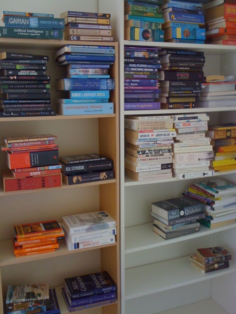a book shelf filled with books and magazines