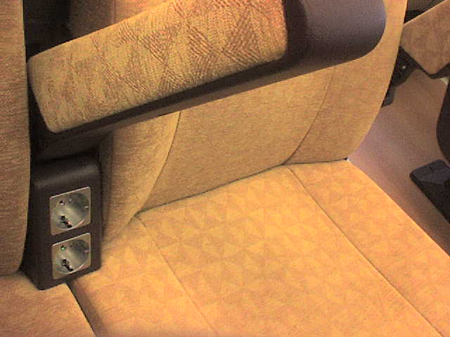 the interior of an automobile with beige fabric