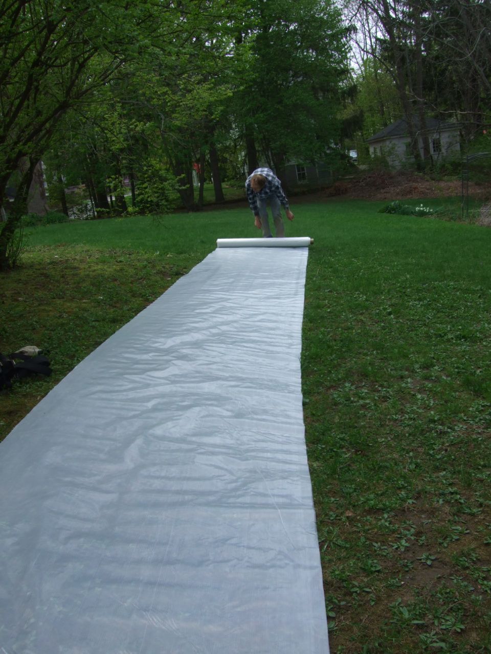a man preparing his skateboard to come down a ramp