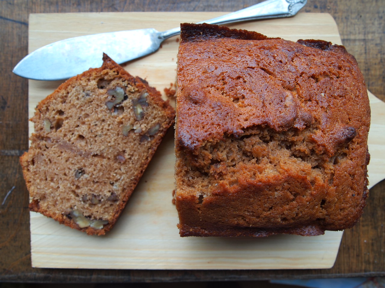 three pieces of cake on a wooden  board