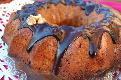 this is a chocolate bundt cake with nuts on top