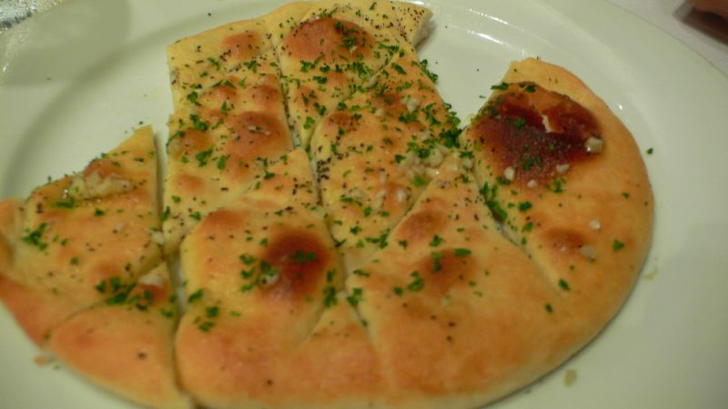 an assortment of bread cut into squares on a plate