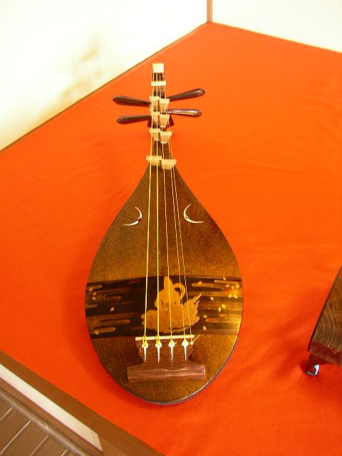 an indian gourmet instrument lying on top of a orange table cloth
