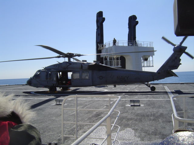 a helicopter on the deck of a ship