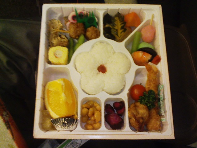 a variety of vegetables and fruit in a compartment