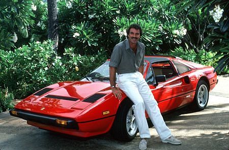 the man sits on top of a red car