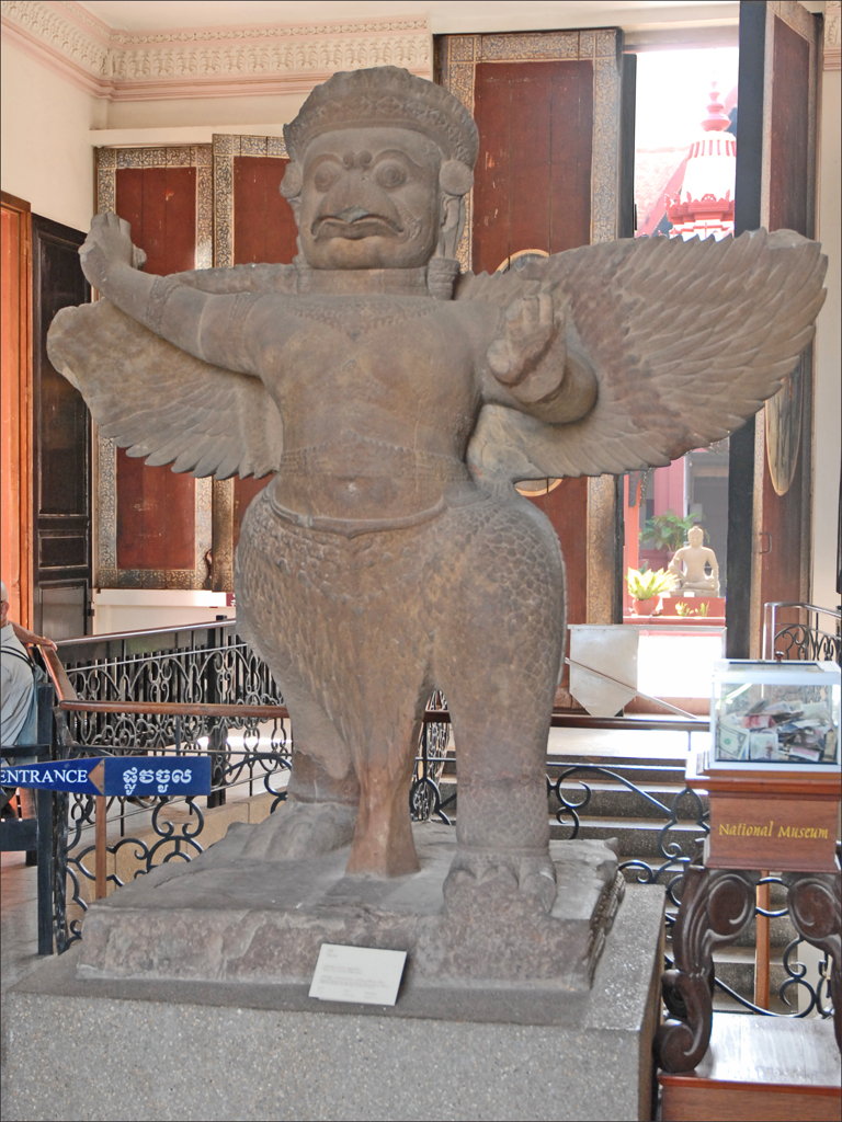 the statue is holding a bird for his wings