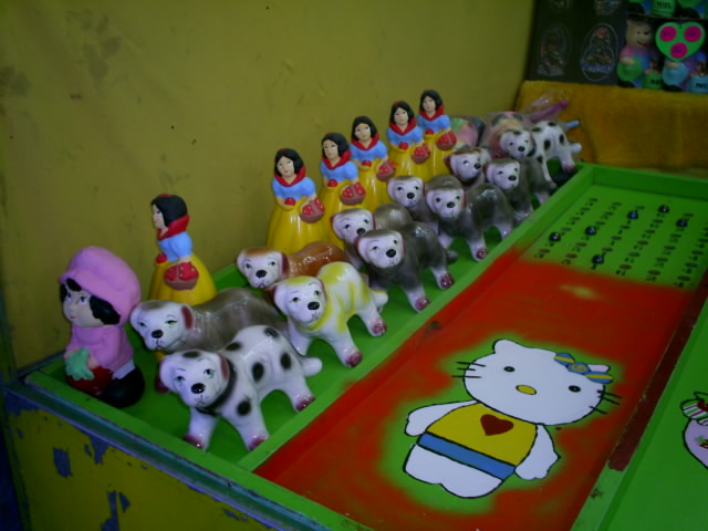 the hello kitty toys are arranged on top of a children's game