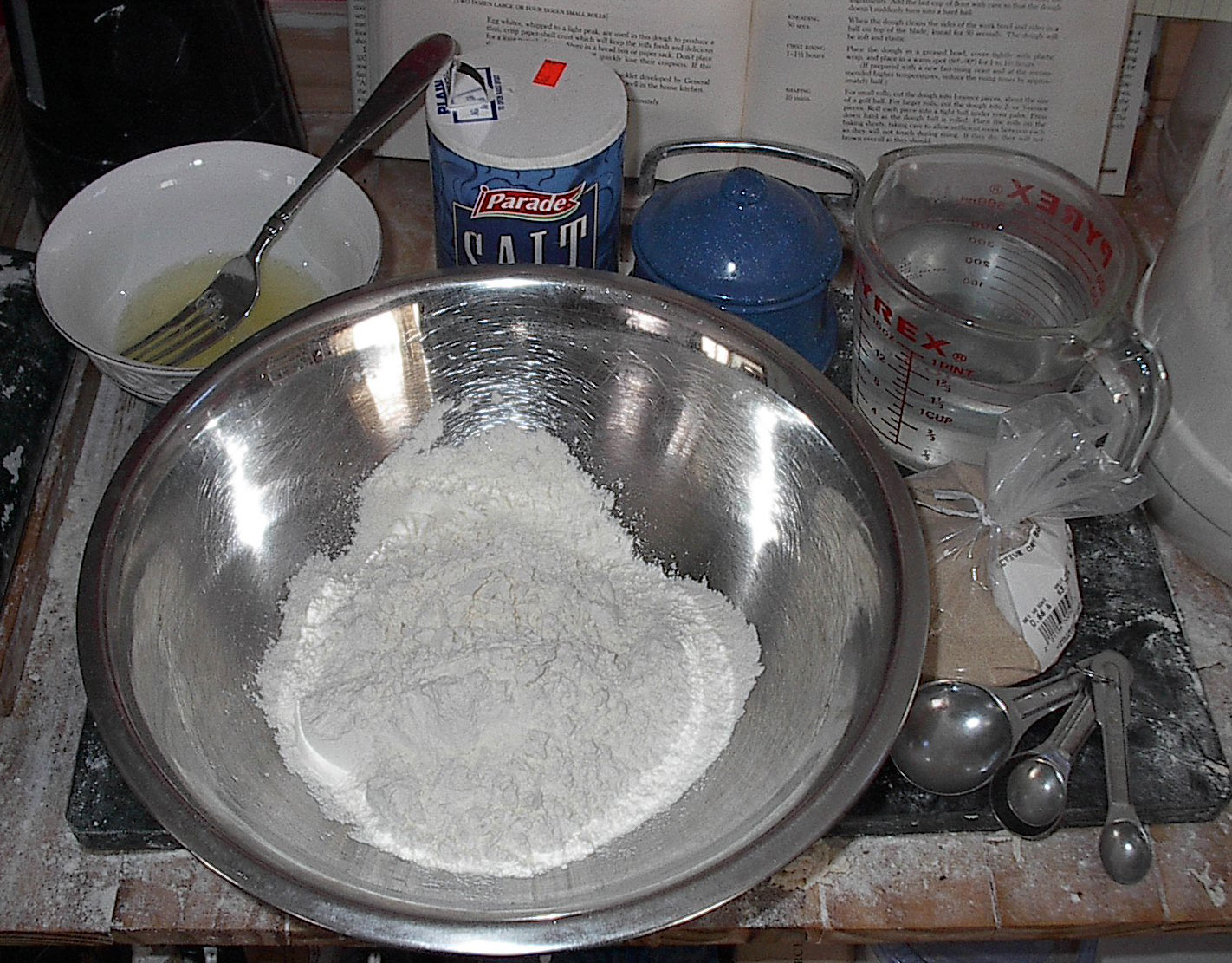the mixing bowl is full of flour and other ingredients