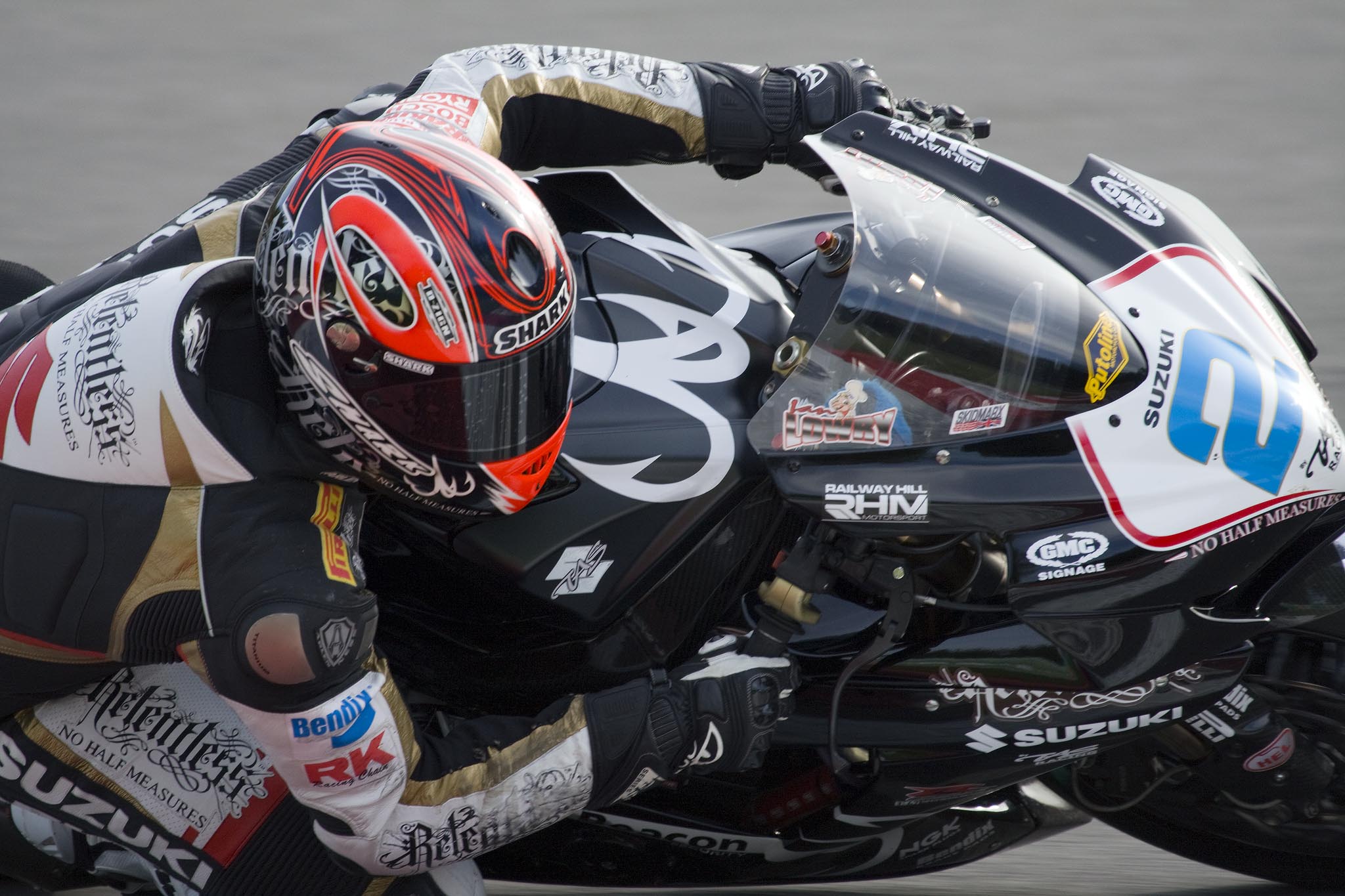 a man riding a motorcycle on top of a race track