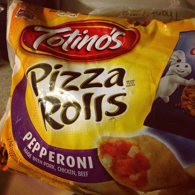 a bag of pizza rolls that have a stuffed ghost in the back
