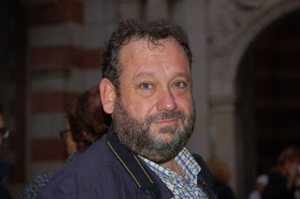 a man with beards and a blue jacket