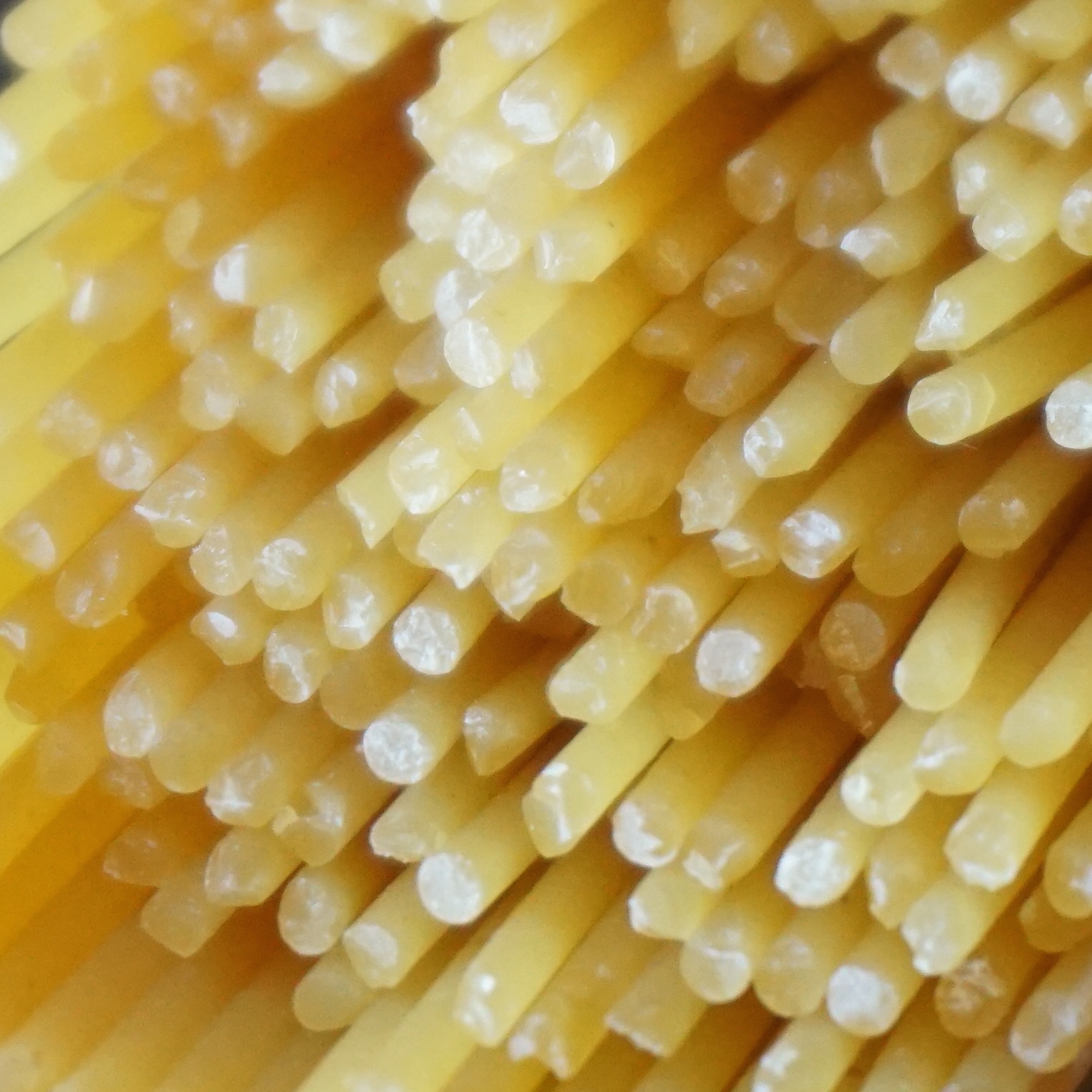 a close up image of yellow pasta noodles