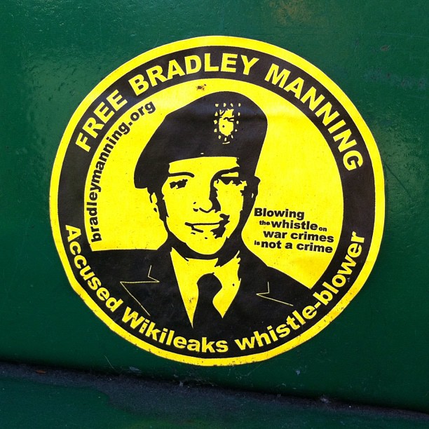 the back end of a vehicle with a sticker of a man in uniform