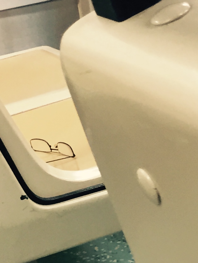 someone's writing on the seat cover of a white toilet