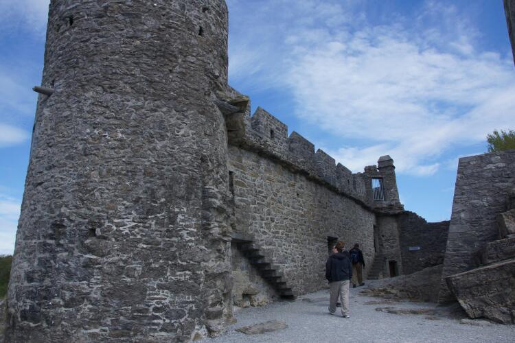 a castle with stone walls and tall towers