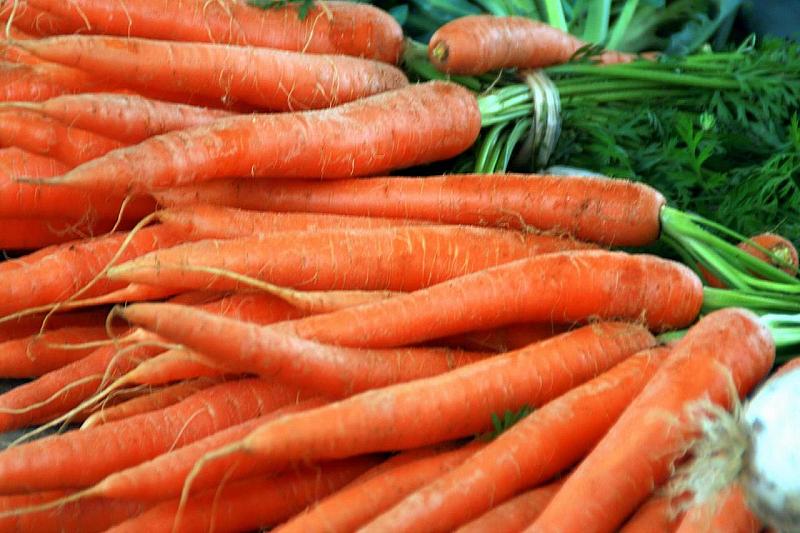 carrots displayed on display at outdoor market area