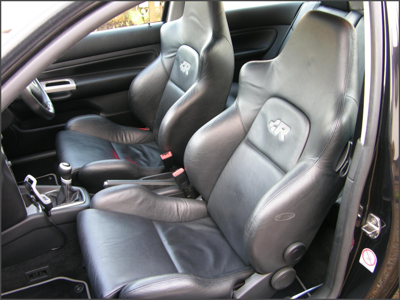 the interior of a vehicle with some black leather