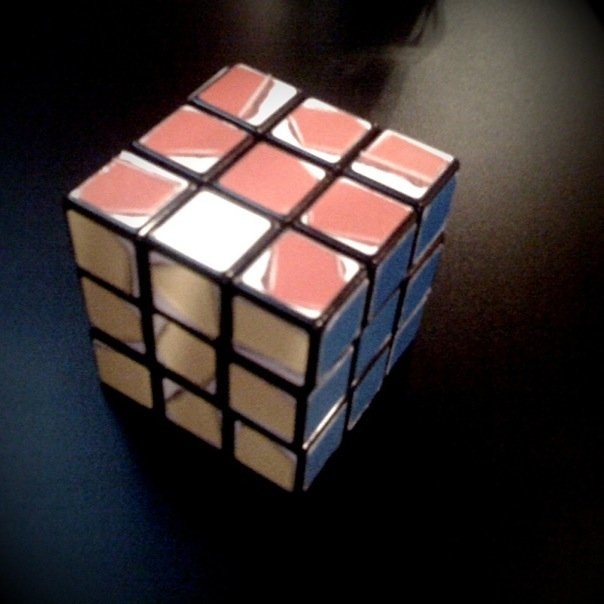 a rubik cube with four sections on the bottom of it