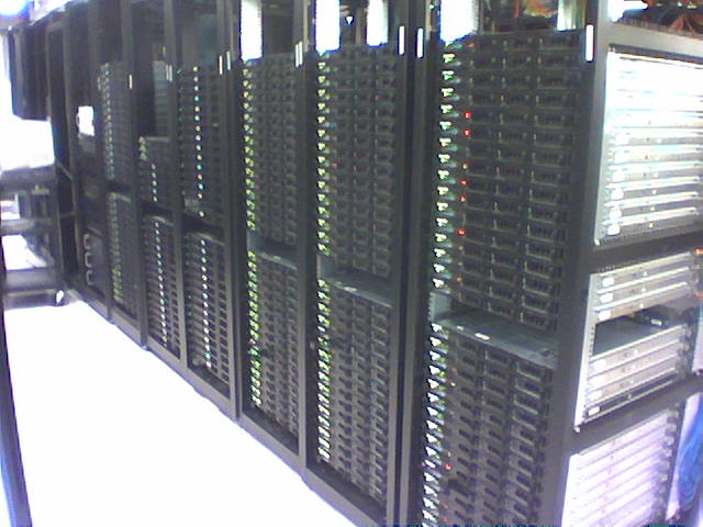 an array of computers on display in a room