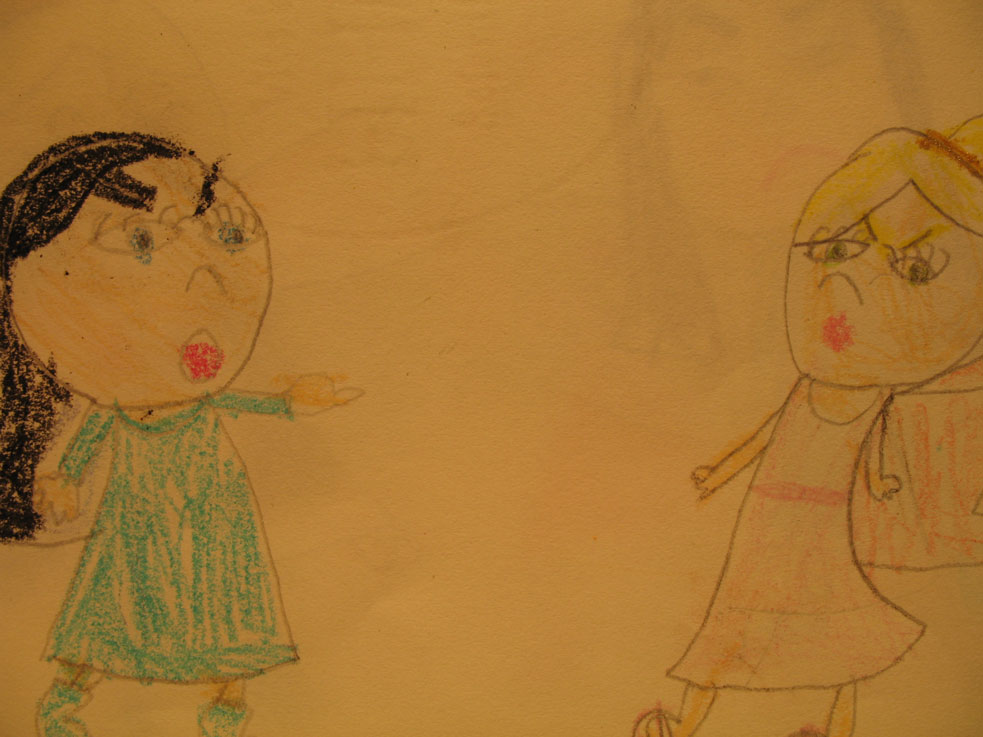 two children with faces drawn on paper near each other