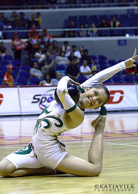 a female volleyball player is playing ball and is doing an accident