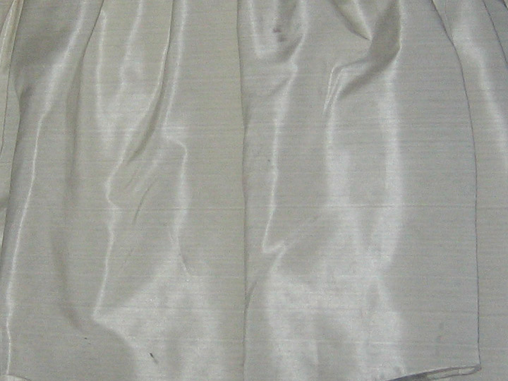 the back side of a skirt with a small amount of lining on it