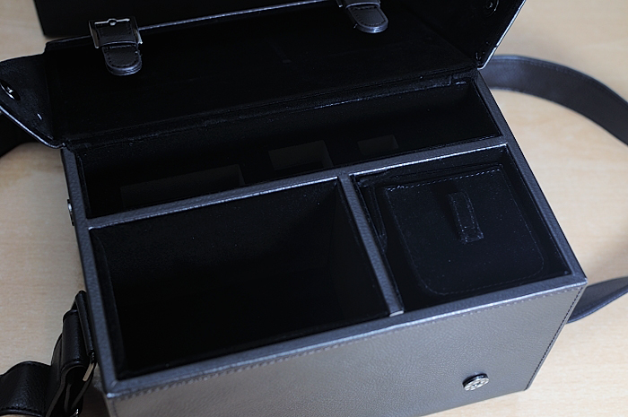 a leather case holding various compartments in a bag