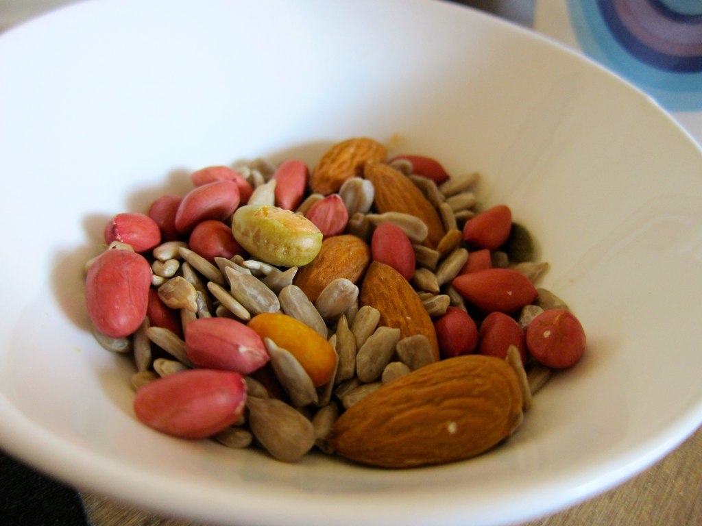 some assorted nuts sit in a bowl