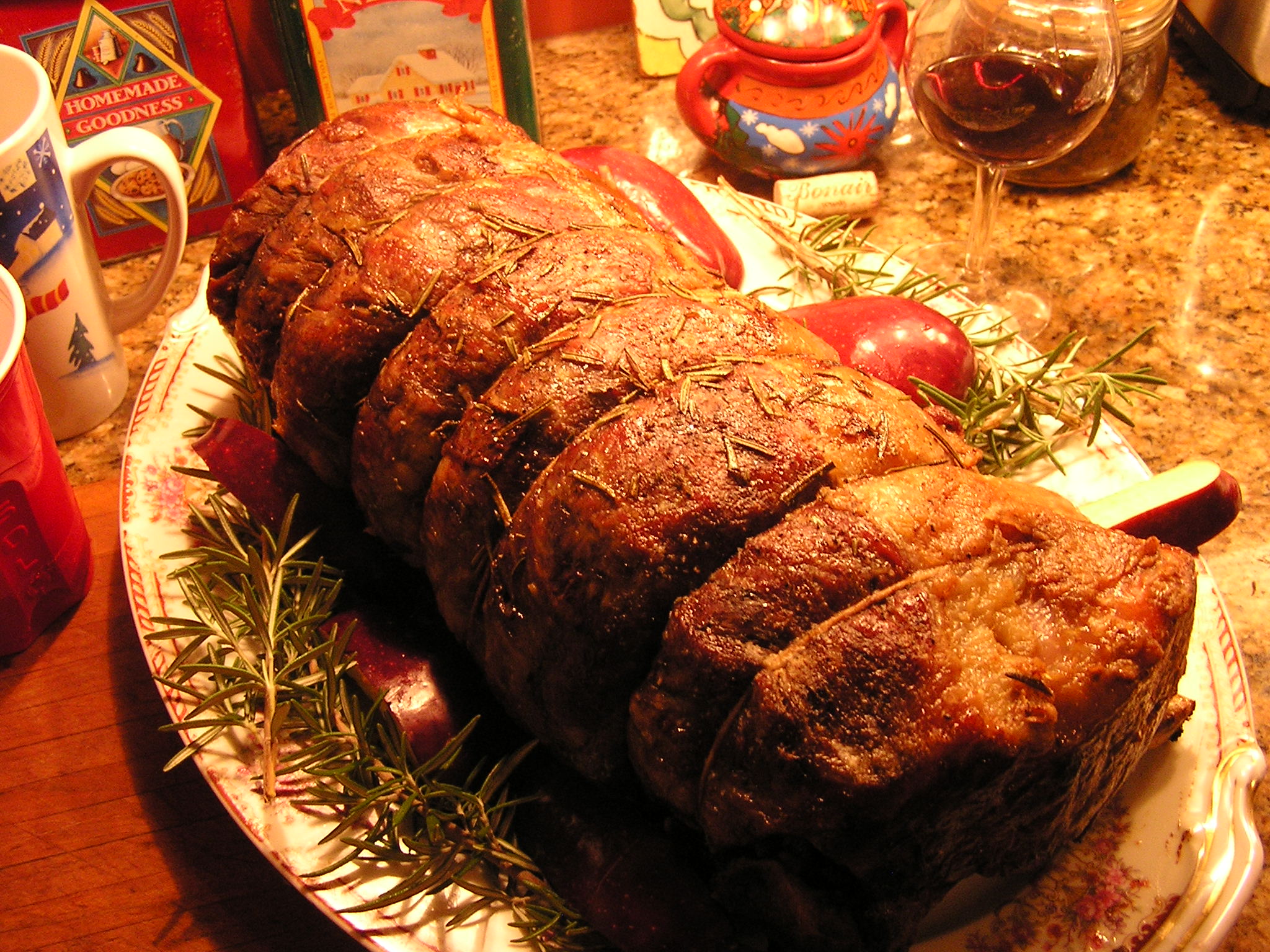 a large roast is covered with meat on a plate