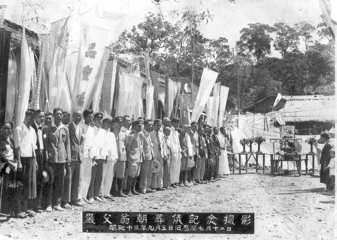 black and white pograph of men with clothing and signs